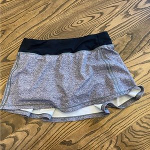 Pace rival mid rise skirt good condition size 4 in heather lux/black.